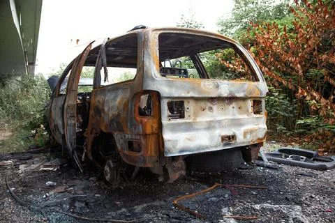 Car after a fire. Burnt rusty car after fire or accident. Car after the fire Stock Photos