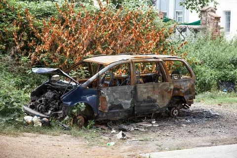 Car after a fire. Burnt rusty car after fire or accident. Car after the fire Stock Photos