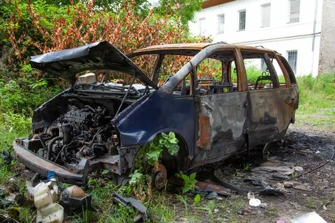 Car after a fire. Burnt rusty car after fire or accident. Car after the fire Stock Photos
