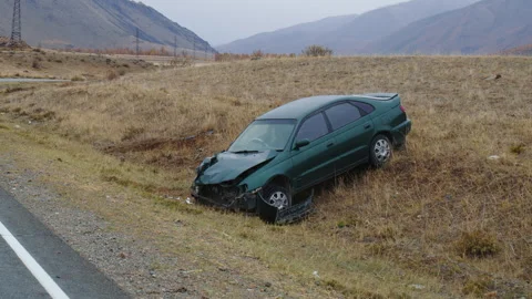 Car after traffic accident is on side of road in mountains Video stock 265667146