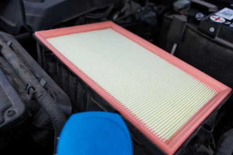 Car air filter close-up. Auto service. Automotive background Stock Photos
