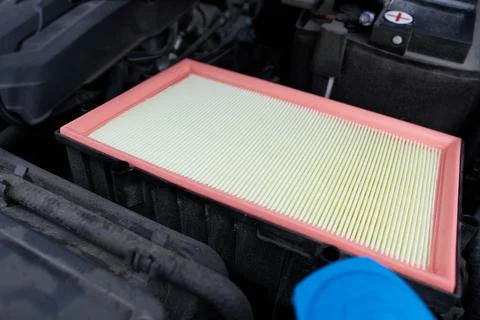 Car air filter, close-up. Auto service industry. Automotive background Stock Photos