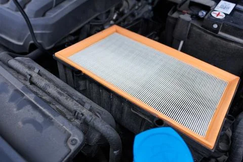 Car air filter in the engine compartment, closeup of photo. Stock Photos