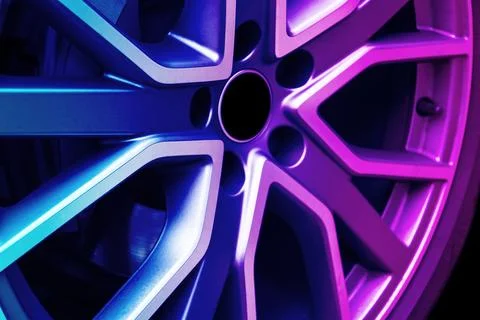 Car alloy wheel texture background in blue and pink tones. New alloy wheel .. Stock-Fotos