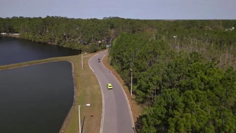Car and golf car moving on the road Stock Footage 244510448