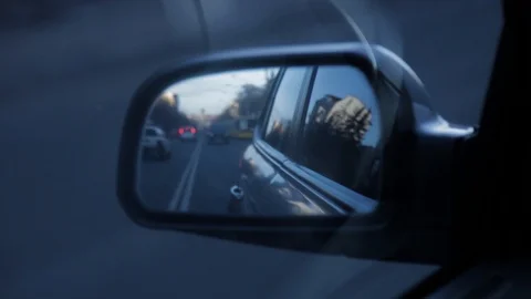 Car approachin in a side rear view mirror Stock Footage 88154849