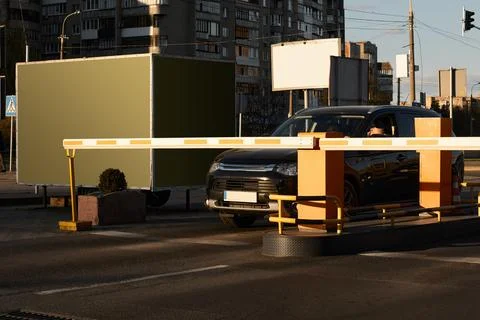Car approaching to automatic barrier gates for supermarket parking lot. Security Stock Photos
