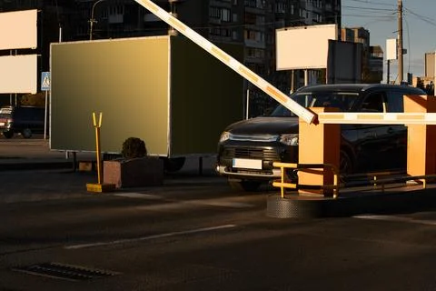 Car approaching to automatic barrier gates for supermarket parking lot. Security Stock Photos