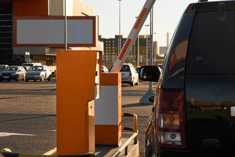 Car approaching to automatic barrier gates for supermarket parking lot. Security Stock Photos