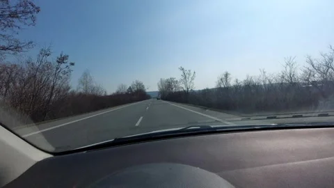 Car Approaching a Directional Arrow Road Sign on a Countryside Highway Stock Footage 333643963