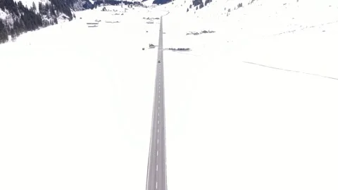 Car approaching on empty alpine road Stock Footage 332134301