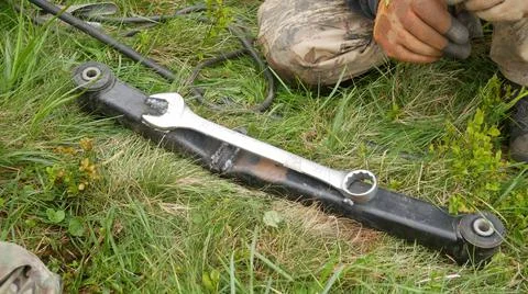 Car arm repair using a welded wrench. 스톡 사진