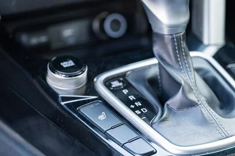 Car automatic gear shift lever and drive mode selector close up Stock Photos