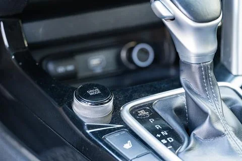 Car automatic gear shift lever and drive mode selector close up Stock Photos