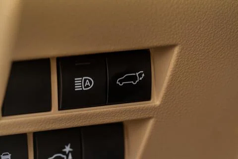 Car automatic high beam switch. Button to raise and lower the light beam. Stock Photos