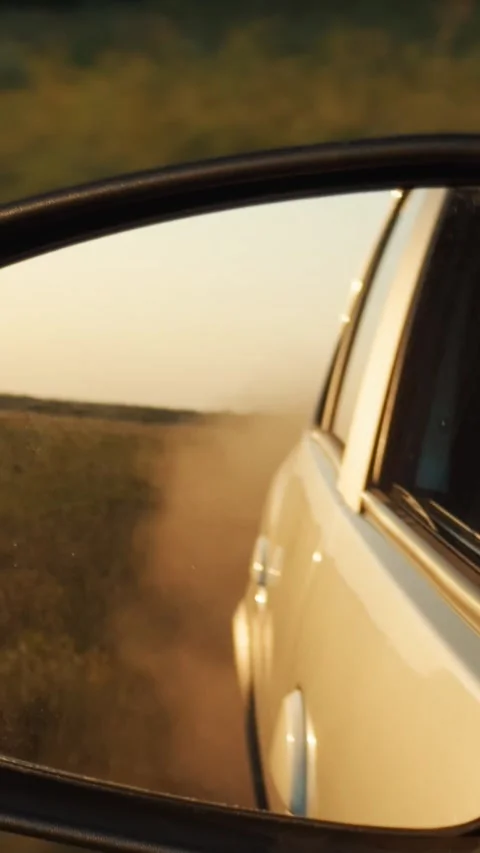 Car automobile reflection rearview mirror driving landscape countryside sunset Stock Footage 301804844