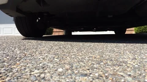 Car Backing Up with Underside Perspective Stock Footage 54374449