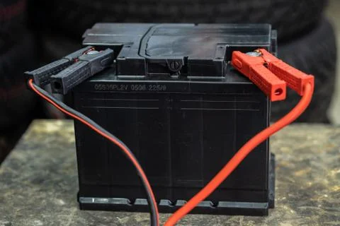 The car battery is charging while it is shaking from voltage. Stock Photos