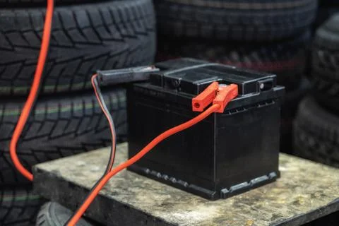 The car battery is charging while it is shaking from voltage. Stock Photos
