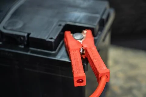 The car battery is charging while it is shaking from voltage. Stock Photos