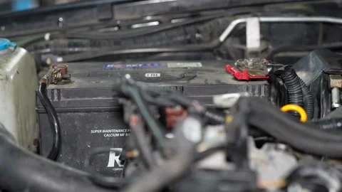 Car Battery Inspection Under Bright Workshop Light Stock Footage 346337895