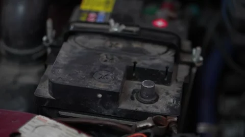 Car Battery Inspection in Workshop Lighting Stock Footage 345567623