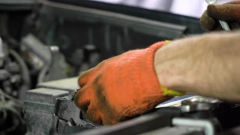 Car battery replacement. close-up. auto repair shop. Video stock 205510656