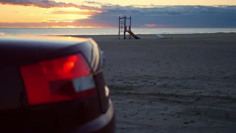 Car in the beach. Audio of the engine idling and accelerating. Nice bokeh. Video stock 168204508