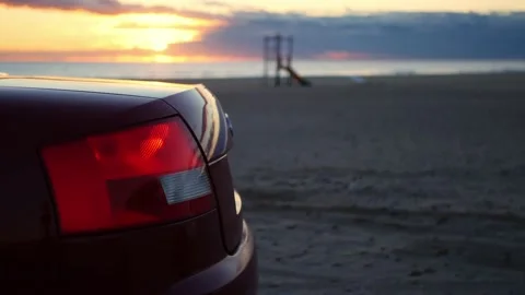 Car in the beach. Audio of the engine idling and accelerating. Nice bokeh. Stock Footage 168204552