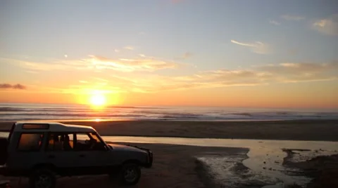 Car on Beach at Sunrise Stock Footage 46128174