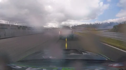 Car being pulled out of the race by another car after a boken motor. Stock Footage 105901570