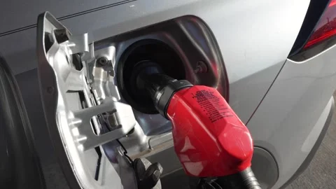 Car being refueled at a gas station Stock Footage 344309664