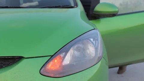 Car with a blinking hazard lights close up. Young man having trouble with car Stock Footage 75922629