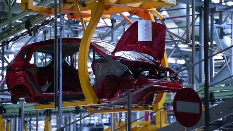 Car bodies on the production line inside automobile factory Stock Footage 74500324