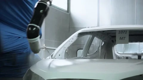 Car body being painted white by robotic arms Stock Footage 170823986