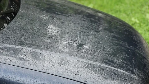Car bonnet in the rain Stock Footage 75987283