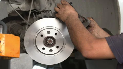 Car Brake System Disc and Pad Replacement Stock Footage 140076400