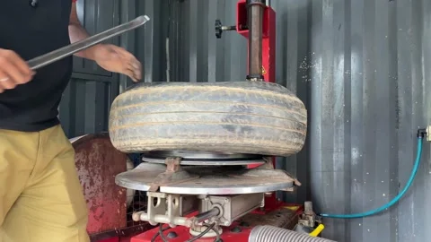 Car breakdown due to bald tyre needed to be changed to new. Stock Footage 166457420