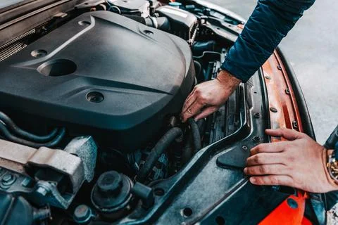 Car breakdown inspection., checking car engine in trunk Stock Photos