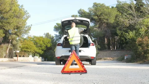 Car breakdown. Man is changing the wheel Stock Footage 87599935