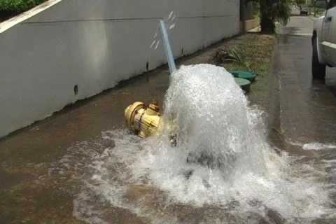 Car Breaks Street Water Fire Hydrant and Stop Sign + audio Stock Footage