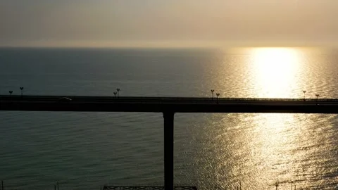 A car bridge on the background of sunset. The highest viaduct in Russia. Sochi Vidéo 163279068