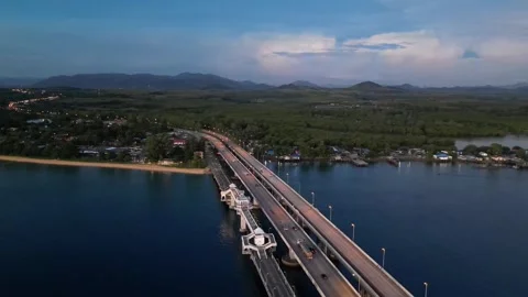 Car bridge to the island during sunset. Drone video Stock Footage 305079161