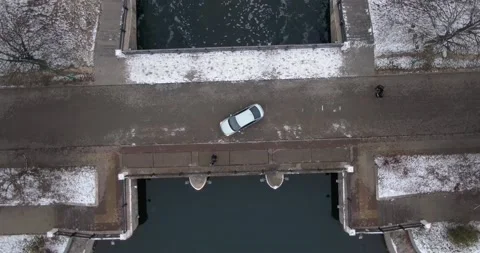 The car is on the bridge. Waterfall. Nice view of the car from the air. Video stock 144875720