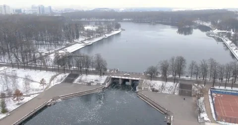 The car is on the bridge. Waterfall. Nice view of the car from the air. Video stock 144875978
