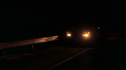 Car broken down on roadside at night with hazard lights Stock Footage