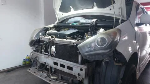 Car bumper, engine, and filter service with component exposure Stock Photos