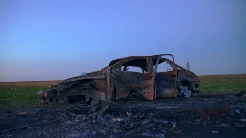 The car burned all over. Ashes from the fire on the whole road Stock Footage 114683450