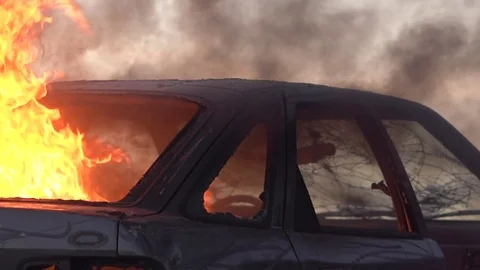 Car burning in flames outside Video stock 73022549