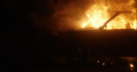 Car burning at night. Close up. Slow motion. Stock Footage 130121997